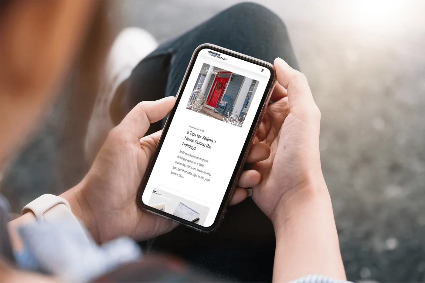 Commission Express blog article open on a phone held in two hands